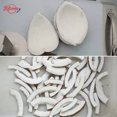 Commercial electric vegetable cutting machine cutting coconuts into chips